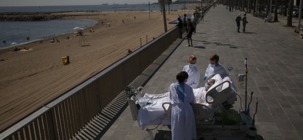 Spain hospital ehgge ICU gai thibi Covid balimeehun beach ah gendhanee