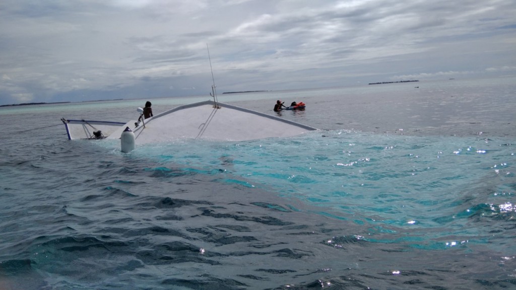 Police provide assistance after boat sinks