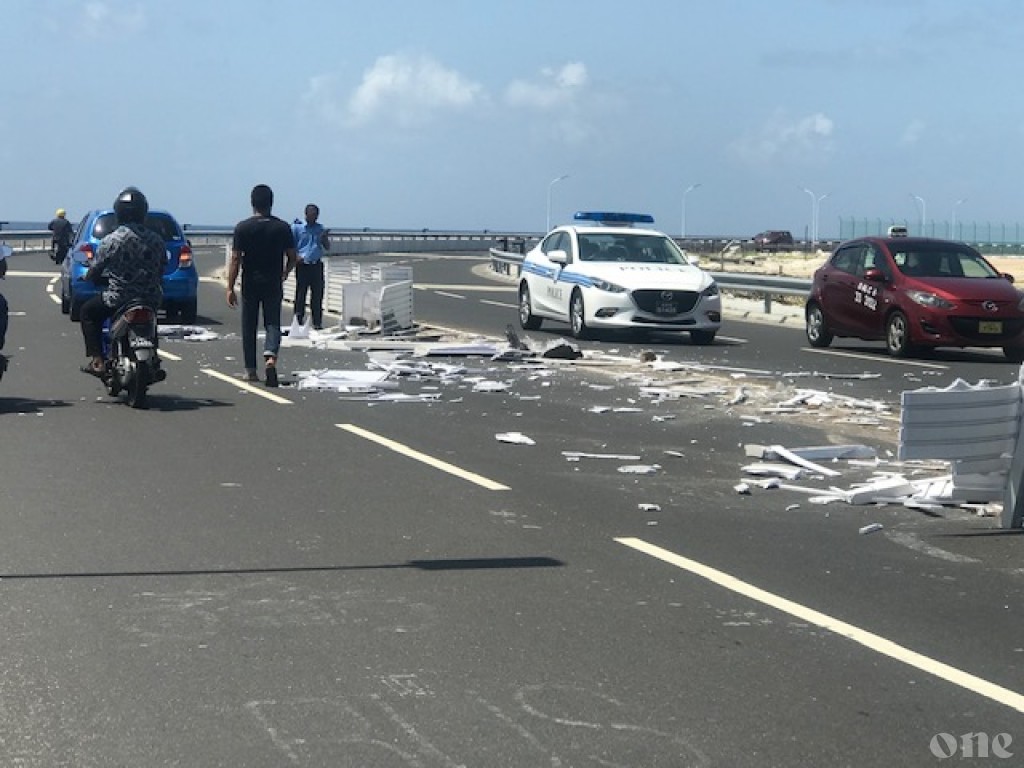 Traffic collision on bridge highway, dividers destroyed