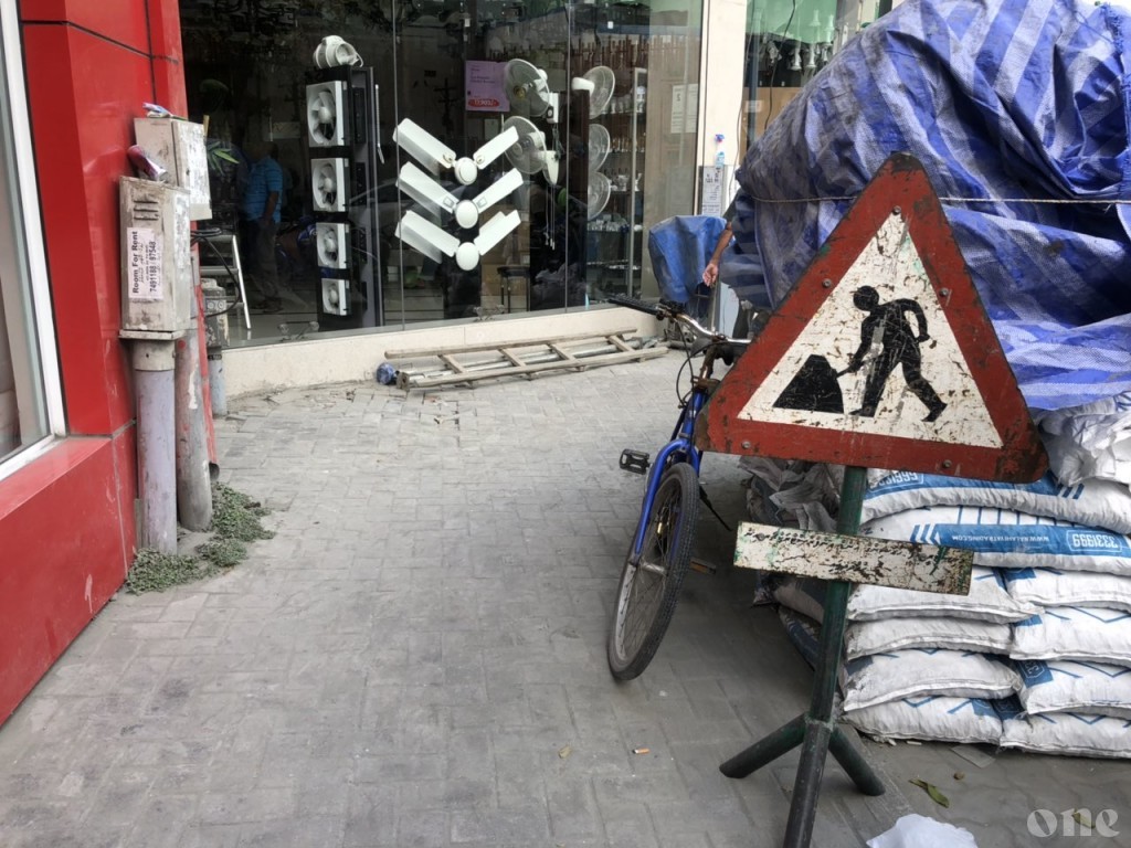 Unlawful vehicle hit by safety rail at construction site, passenger sustained head trauma
