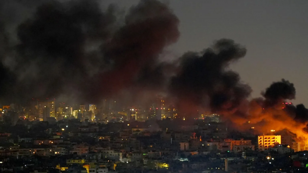 Blasts heard in Lebanon as Israel vows to hit banks