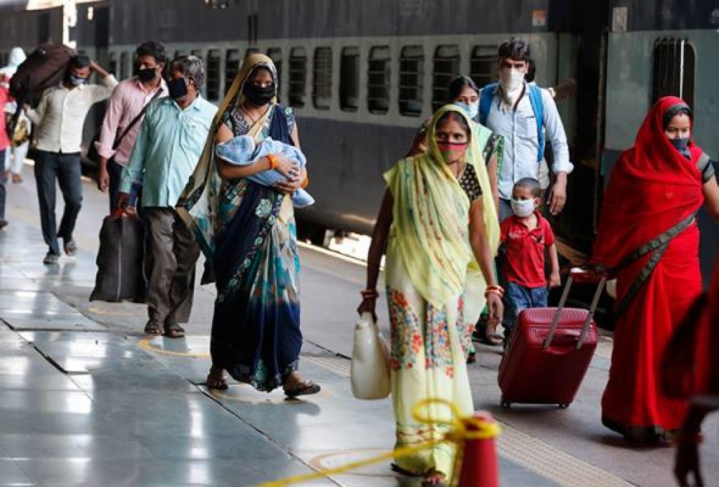 India's COVID-19 surge eases slightly as millions take exams, pubs reopen