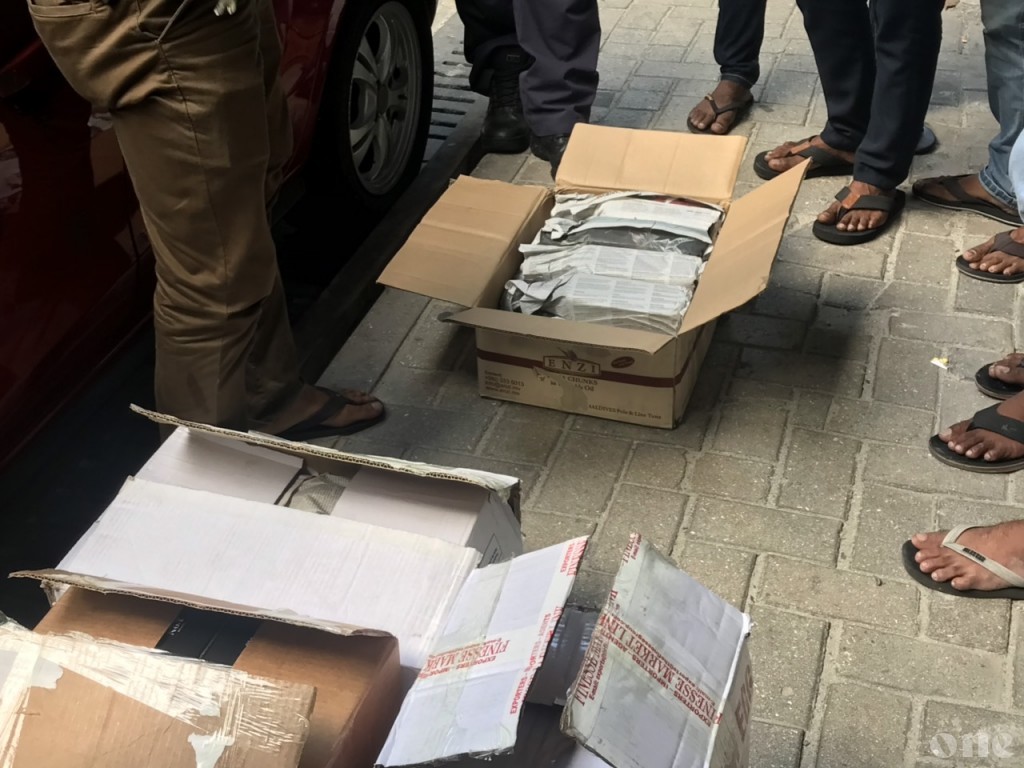 Taxi carrying alcohol in empty by boxes in Male'