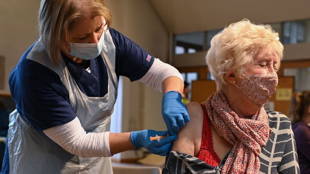 UK vaccination drive expands as COVID-19 toll nears 100,000