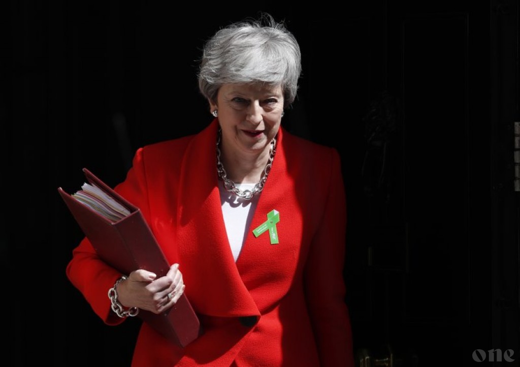 UK PM promises timetable in June for her exit date