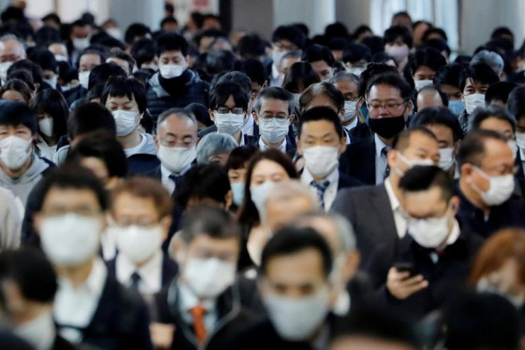 Tokyo raises COVID-19 alert to highest level as cases set record
