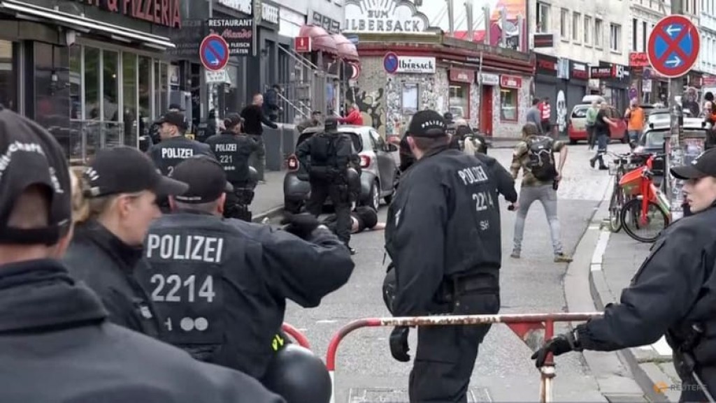 German police shoot axe-wielding man at Hamburg football fan parade