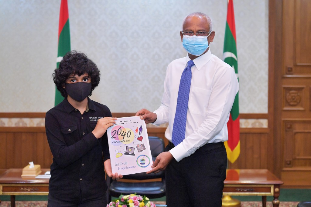 President presented with two children’s publications by the Ugail Foundation