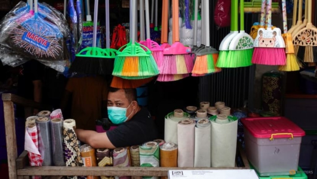 Indonesia extends COVID-19 curbs as infections spread in regions