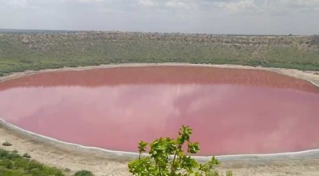 ‘From green to pink’: Crater lake makes dramatic colour change in India