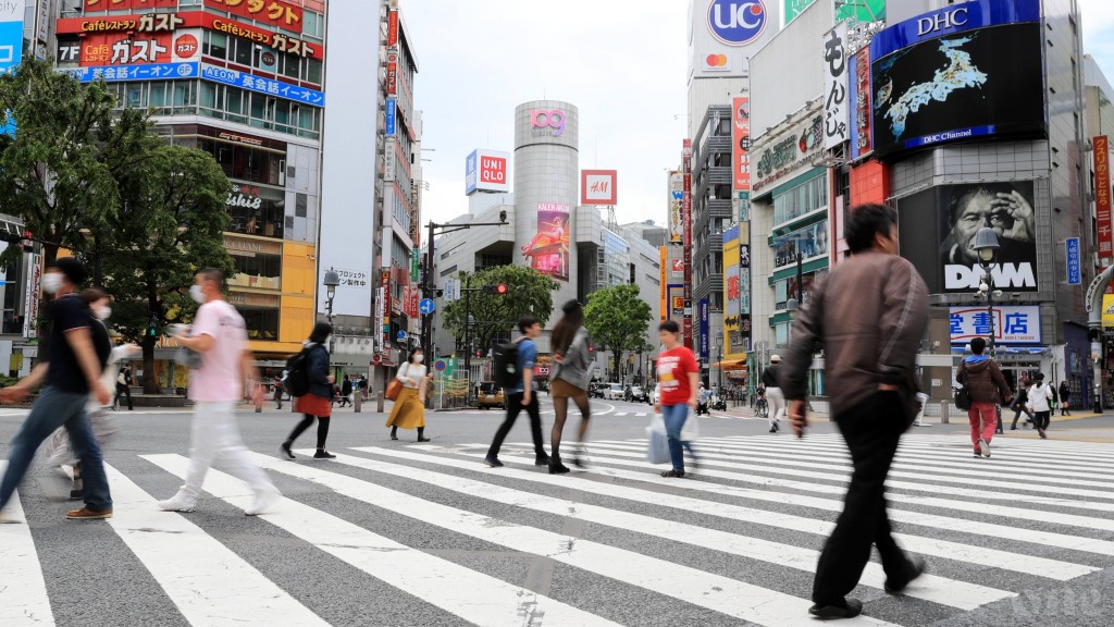 Japan lifts COVID-19 emergency but urges caution