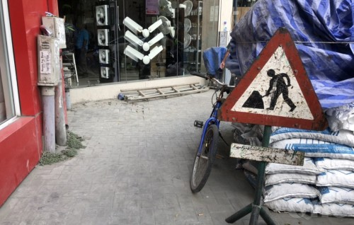Unlawful vehicle hit by safety rail at construction site, passenger sustained head trauma