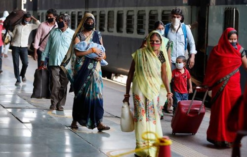 India's COVID-19 surge eases slightly as millions take exams, pubs reopen