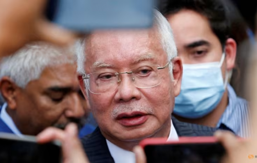 Former Malaysian premier Najib Razak’s jail term halved from 12 to 6 years