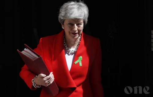 UK PM promises timetable in June for her exit date