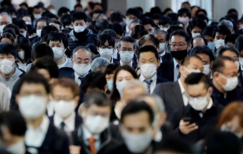 Tokyo raises COVID-19 alert to highest level as cases set record