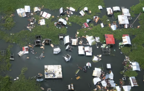Philippine rescuers battle floodwaters to reach stranded