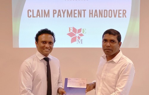 Dhivehi Insurance hands over claim payment to Fuel Express Maldives