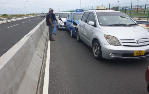 Four cars and a pickup collide on the bridge