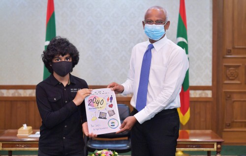President presented with two children’s publications by the Ugail Foundation