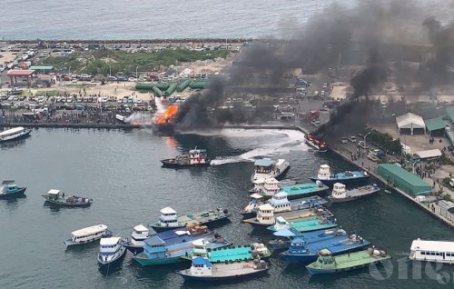 Fire on speed boat and fuel barge at T-Jetty